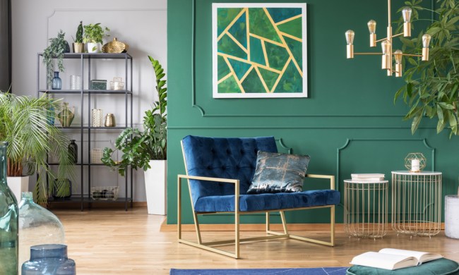 Green living room with gold accent pieces