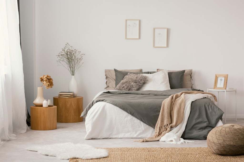 layered rugs in boho bedroom design