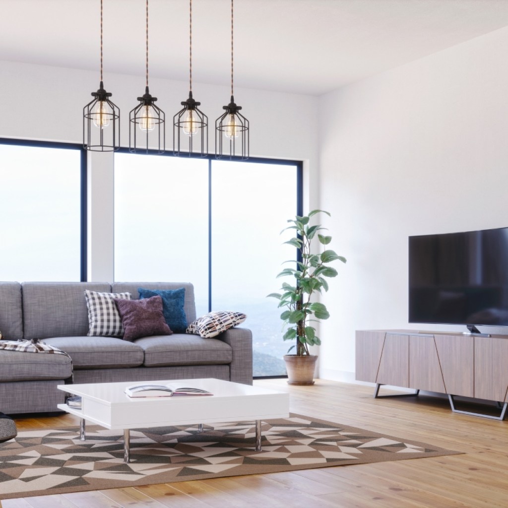 modern living room with grey sofa plant decor and wood tones