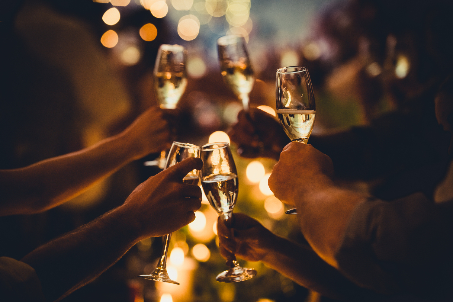People toasting champagne on New Year's Eve