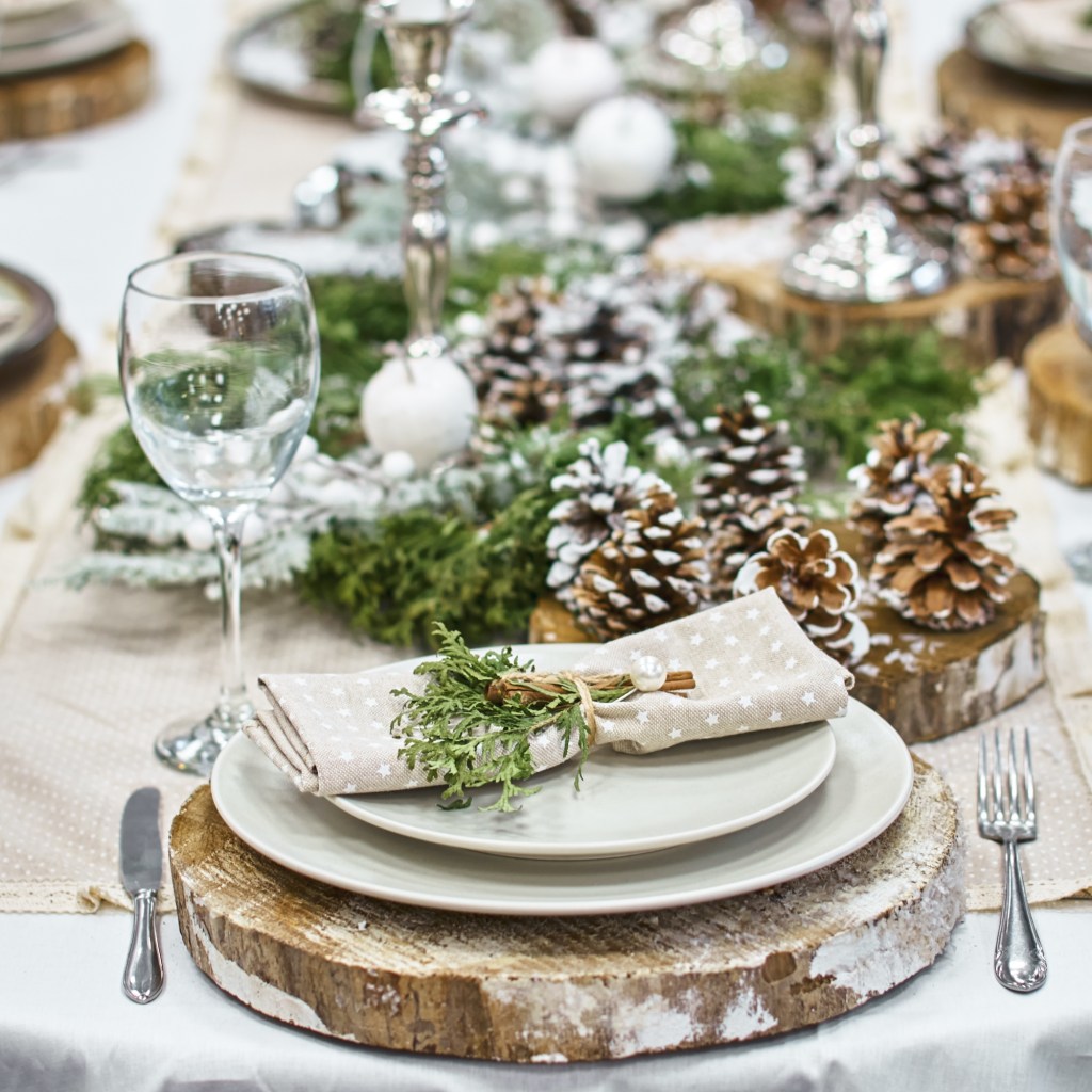 Table set with pine cones and pine branches