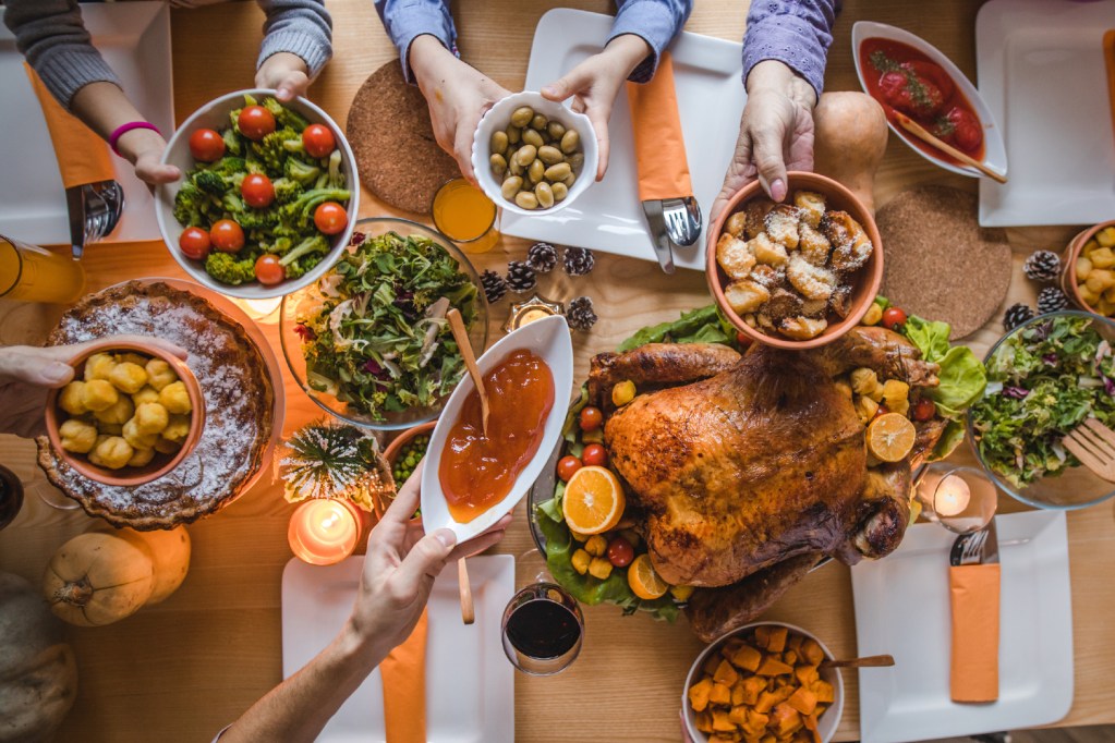 Family eating Thanksgiving dinner.