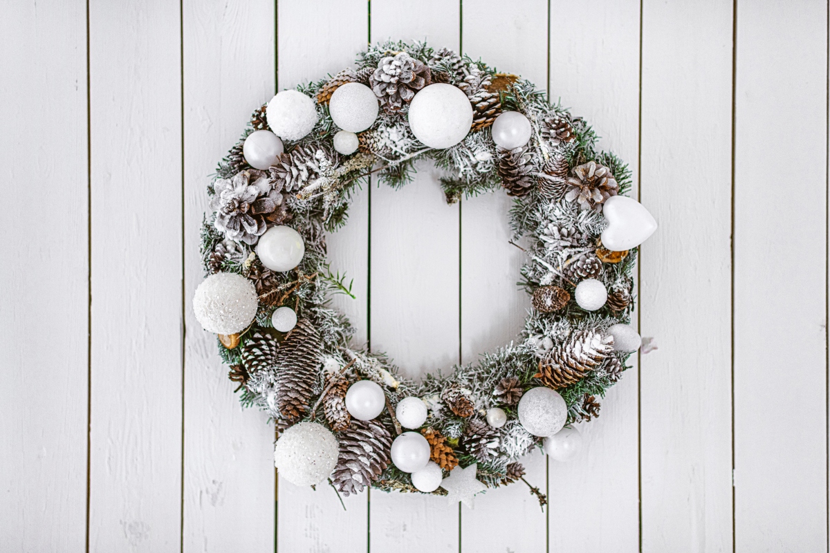 white evergreen winter wreath on white background