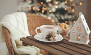Wood table with a white ceramic mug for Christmas