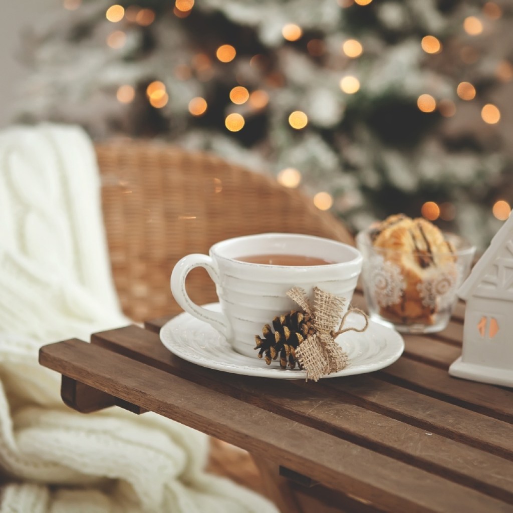 Wood table with a white ceramic mug for Christmas