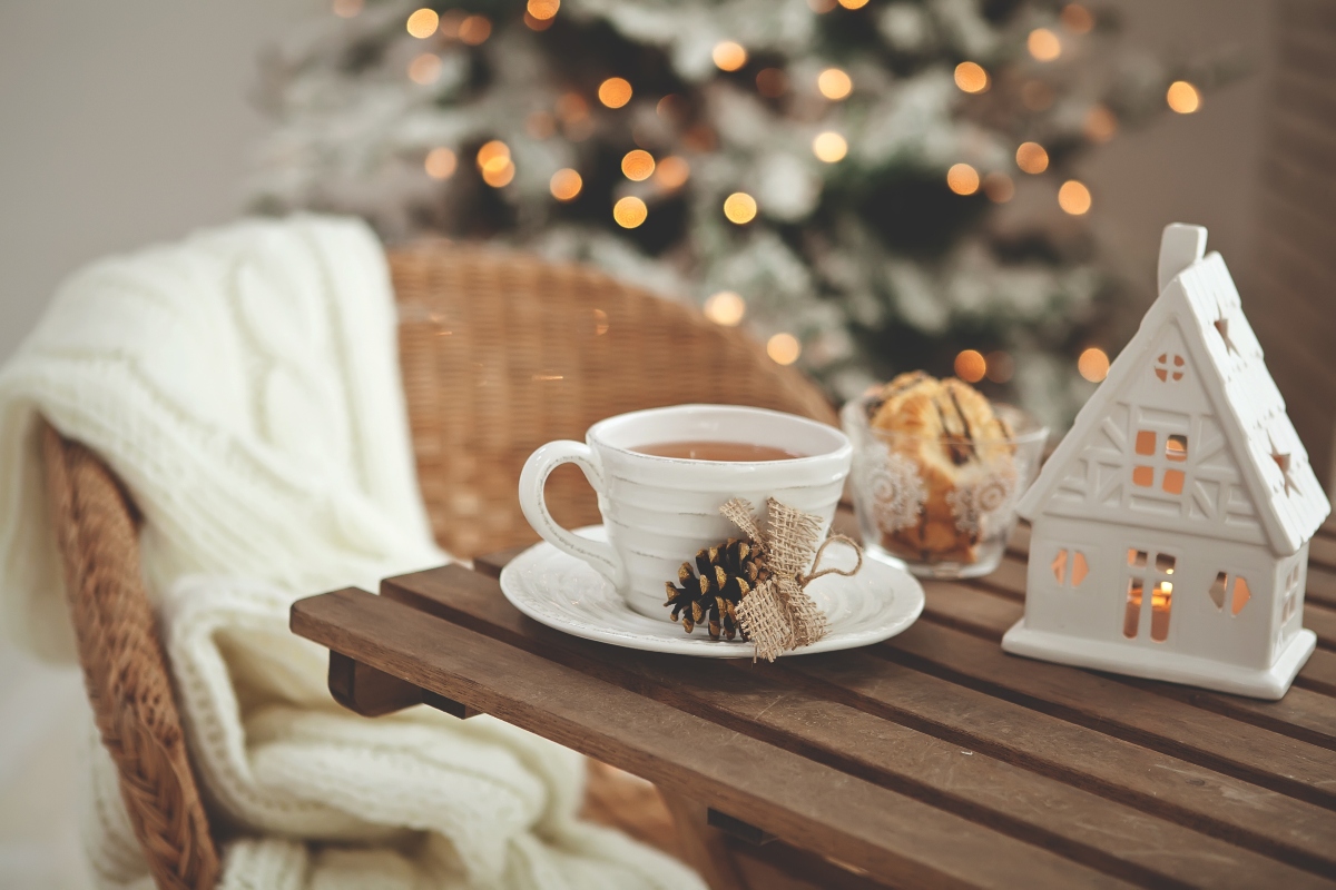 Wood table with a white ceramic mug for Christmas