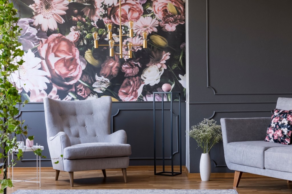 Vintage floral wallpaper with a gray chair