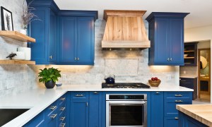 Kitchen with blue frame fronted cabinets