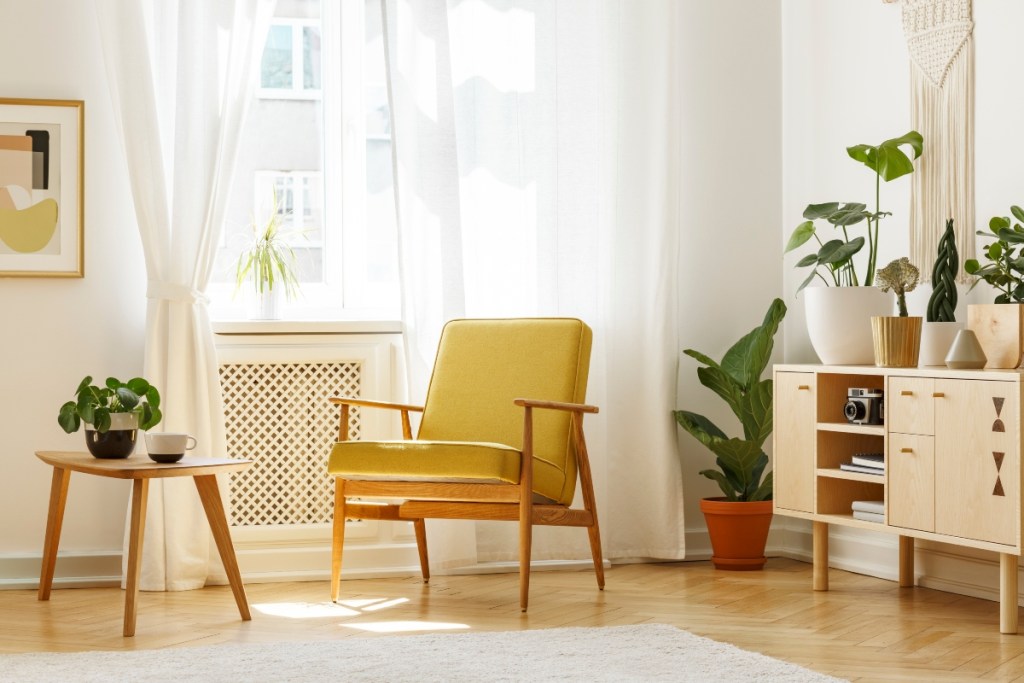 Midcentury modern yellow chair and side table