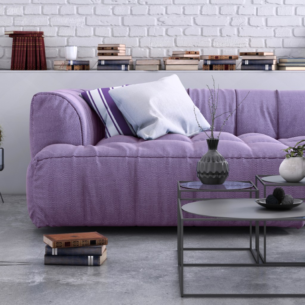 Living room with purple couch.