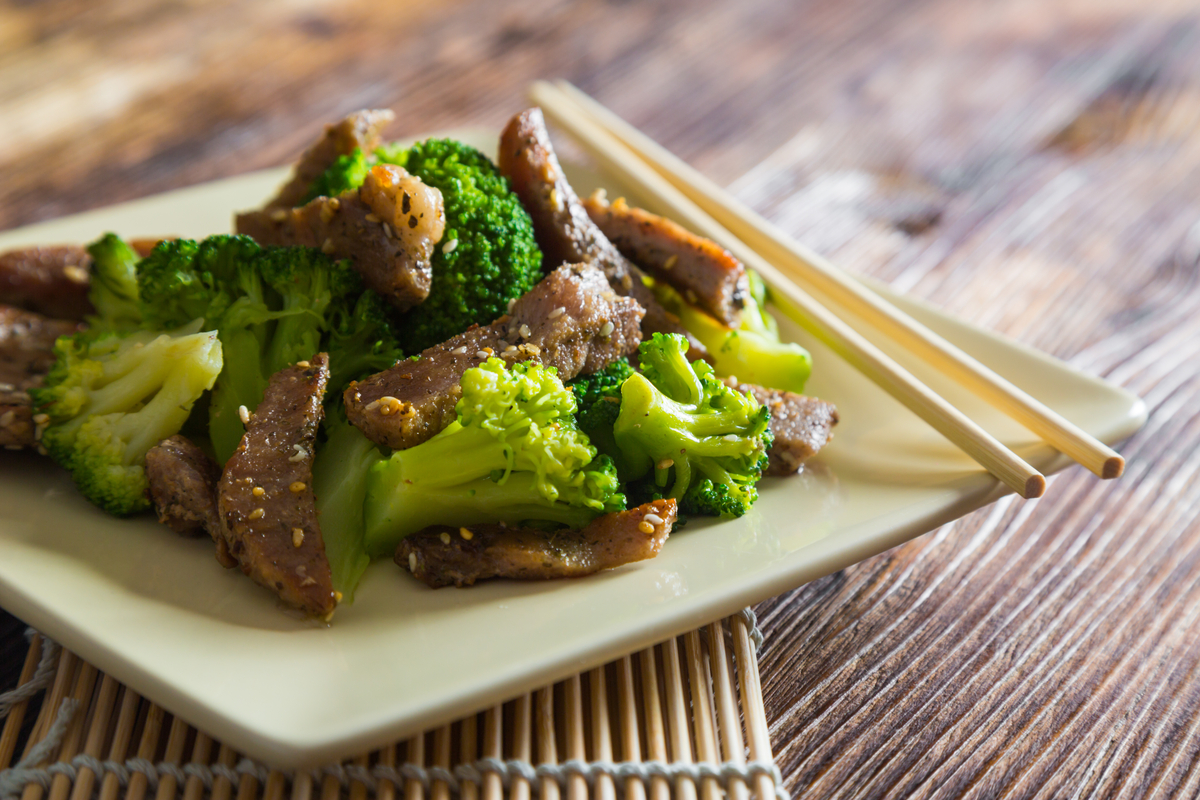 Beef and broccoli dish with chopsticks