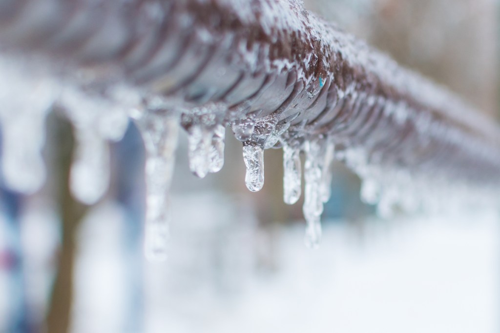 Frozen pipes with dripping ice