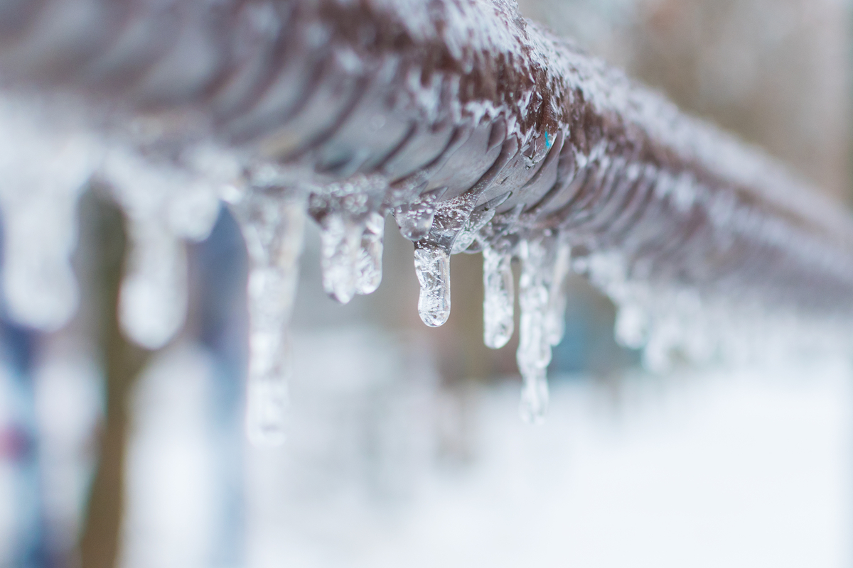 Frozen pipes with dripping ice
