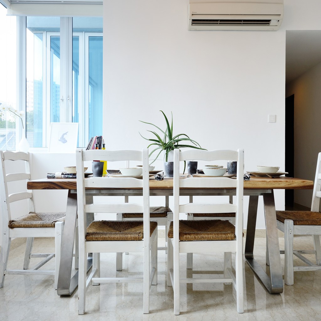 Small, white dining room with natural light