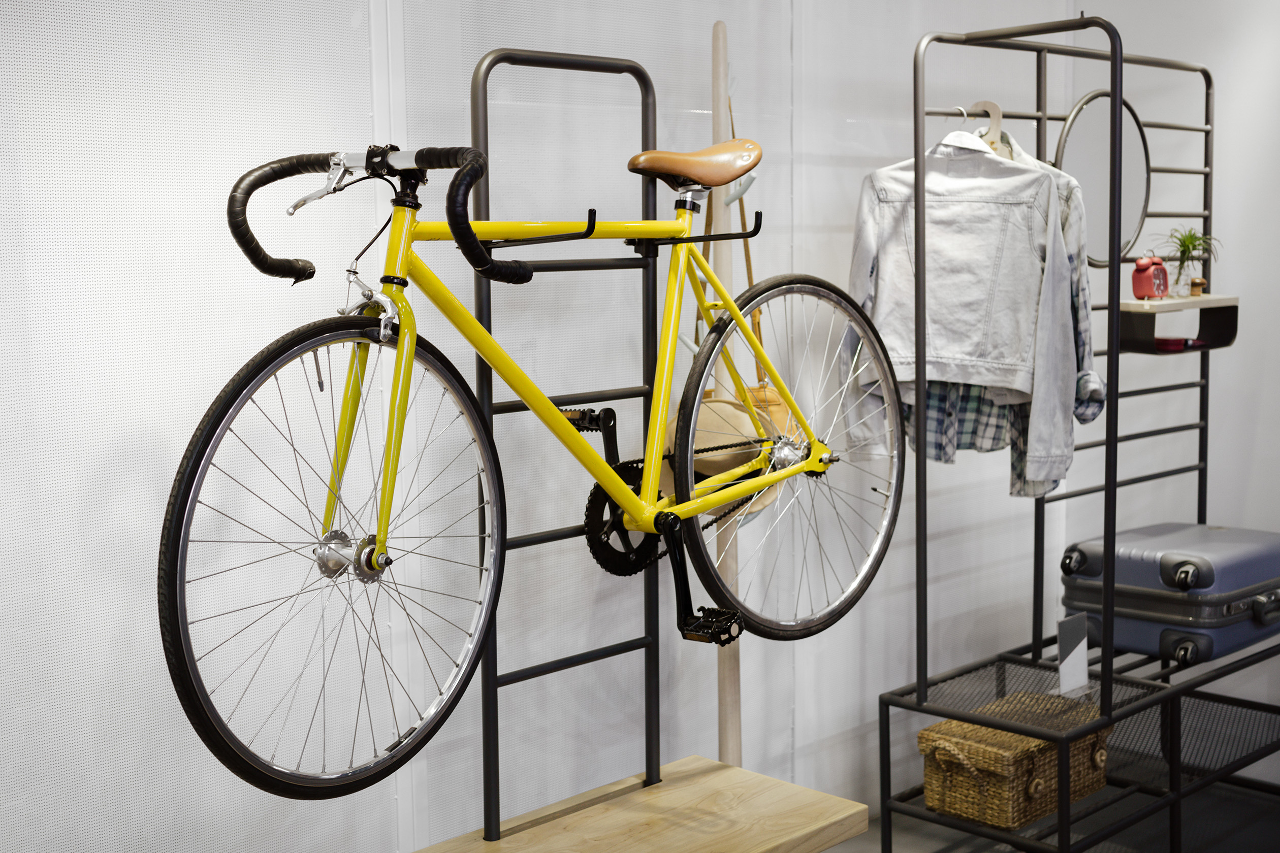 Yellow bicycle hanging on wall rack
