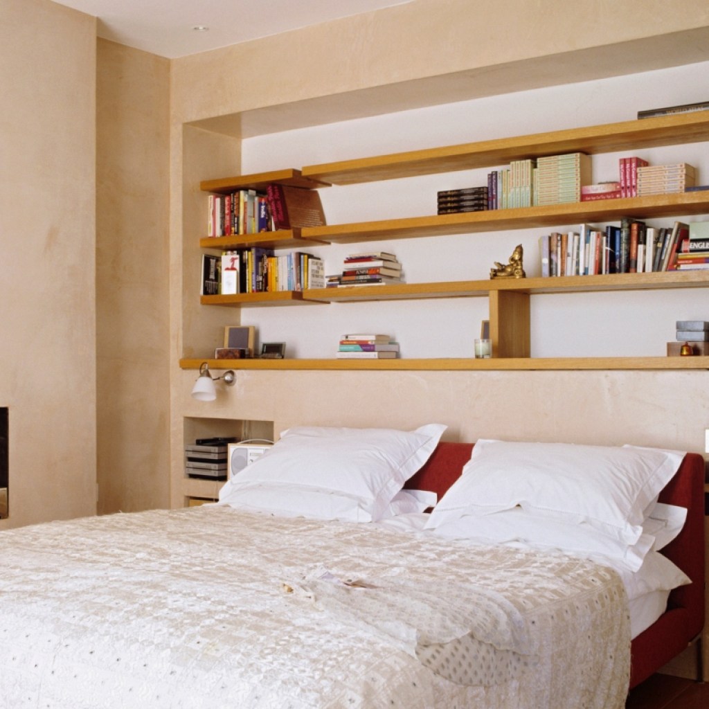 Above bed built-in shelving for small bedroom design