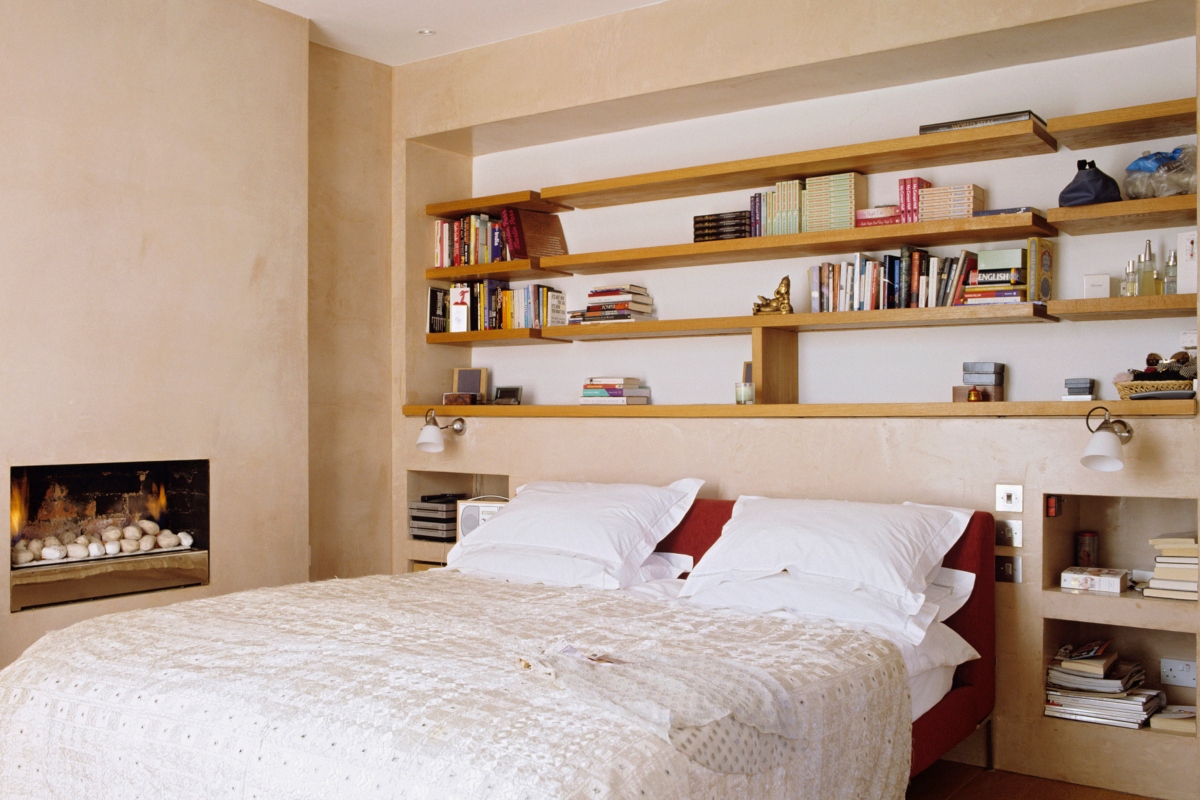 Above bed built-in shelving for small bedroom design