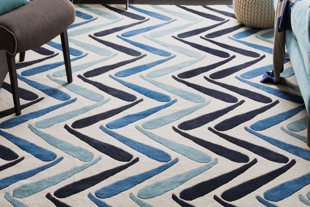 blue patterned rug on floor