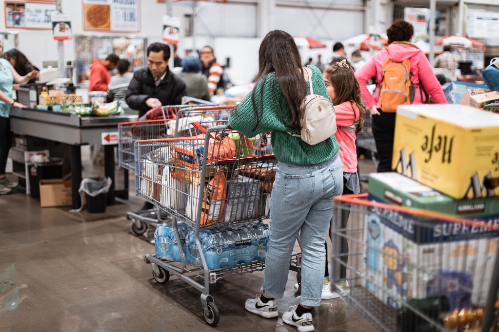 Crowded checkout line at a warehouse grocery store