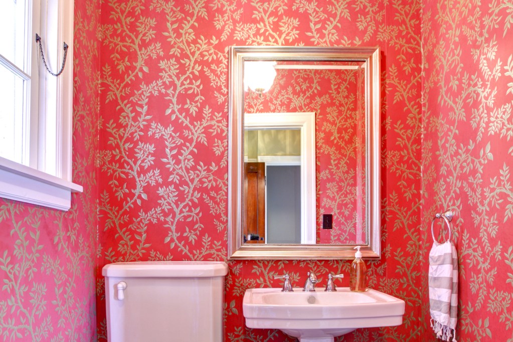 Maximalist bathroom with wallpaper