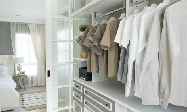 built in closet with drawings and hanging white tshirts