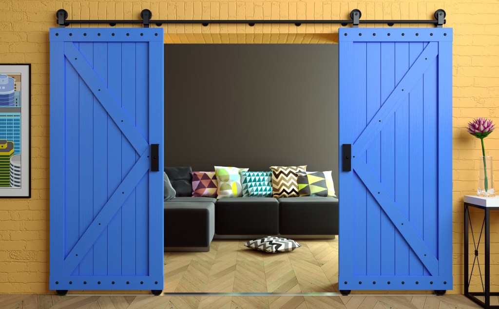 Modern interior in loft-style with barn sliding wooden door