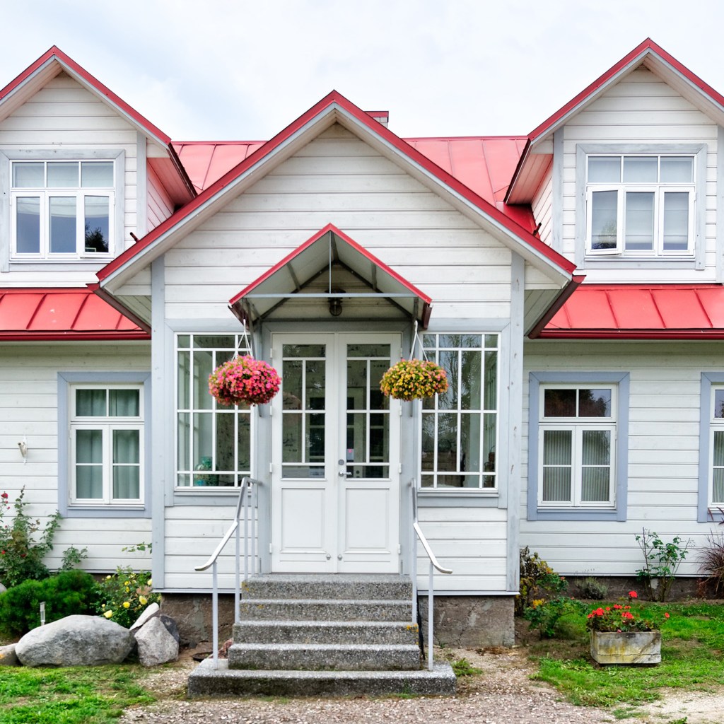 White Cape Cod-style house with a red roof