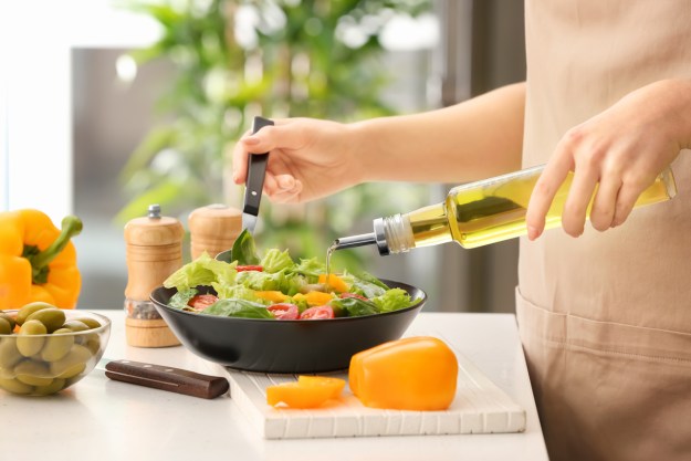 https://www.21oak.com/wp-content/uploads/sites/7/2022/01/woman-making-healthy-salad.jpg?resize=625%2C417&p=1