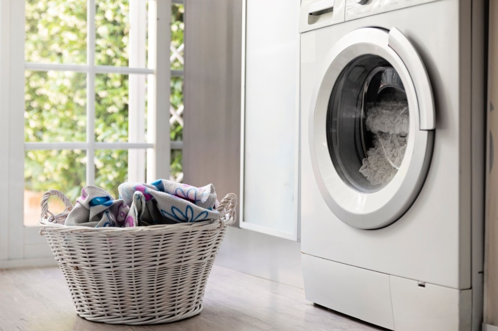 Close-up of a laundry basket and washing machine