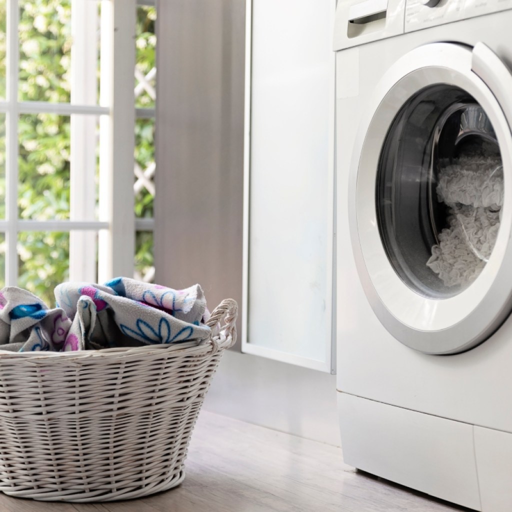 Close-up of a laundry basket and washing machine