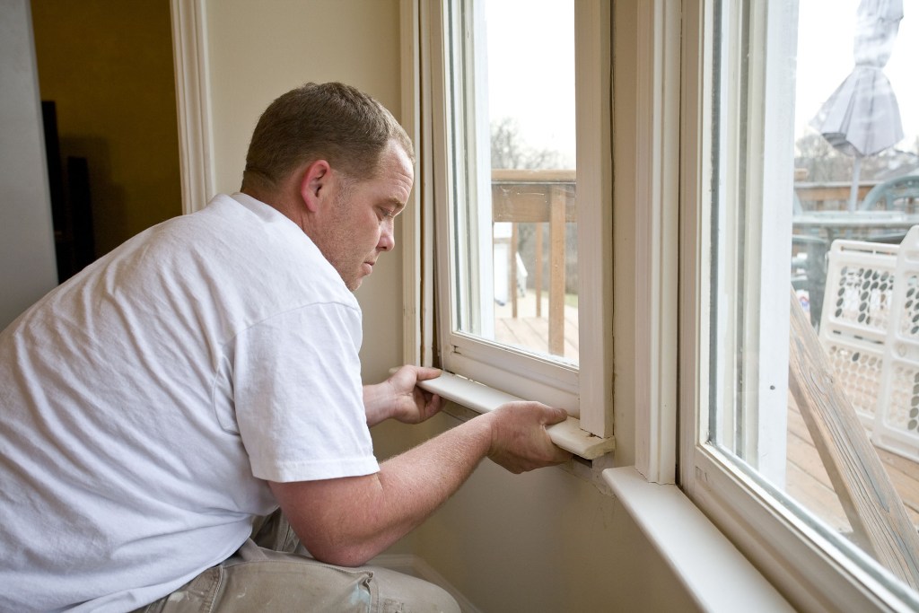 how to trim a window interior carpenter repairing frames home is being updated be