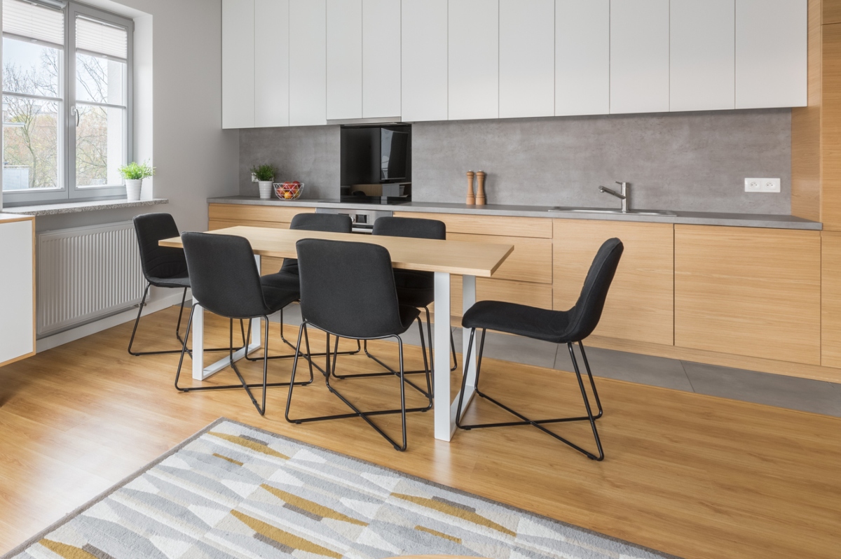 oak wood flooring and cabinets in modern kitchen