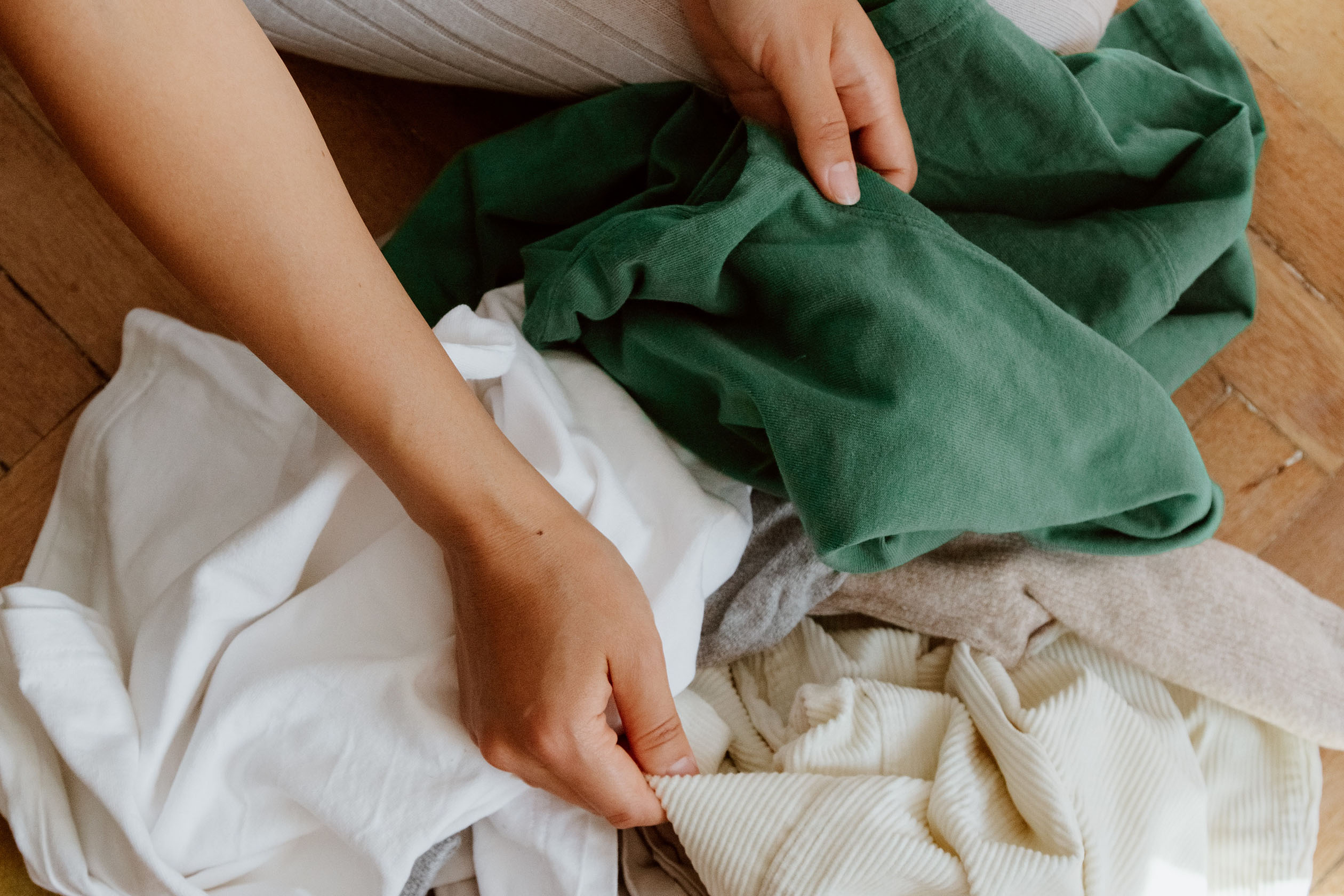 Person sorting through old clothes