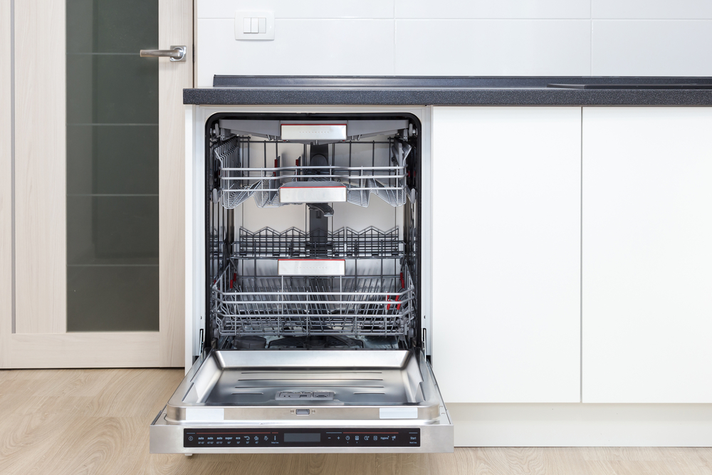 Front view of open dishwasher in a modern kitchen