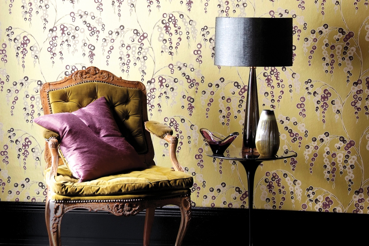 yellow vintage wallpaper with vintage chair and side table