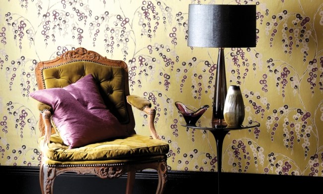 Yellow vintage wallpaper with vintage chair and side table
