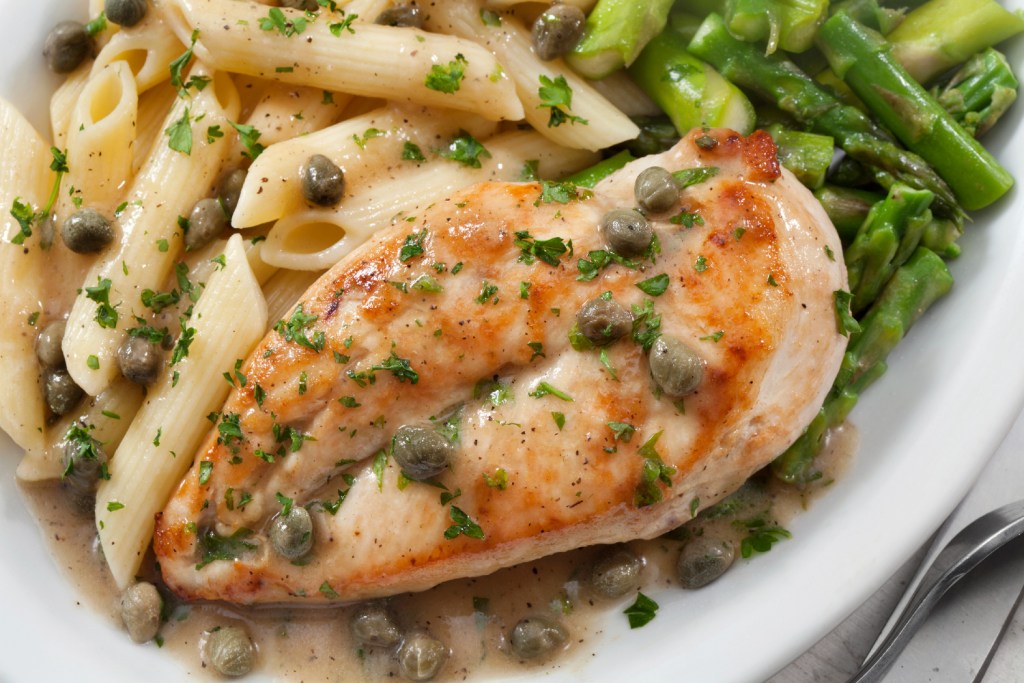 Close up of Chicken Piccata with pasta.
