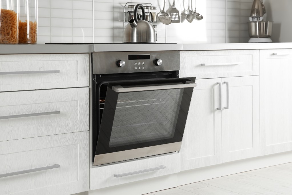 open oven door on silver stove