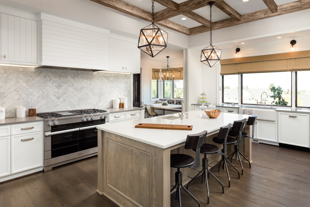 Rustic farmhouse kitchen with white quartz countertops