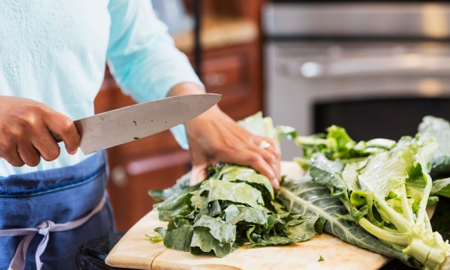 how to cook vegan collard greens woman chopping on cutting board