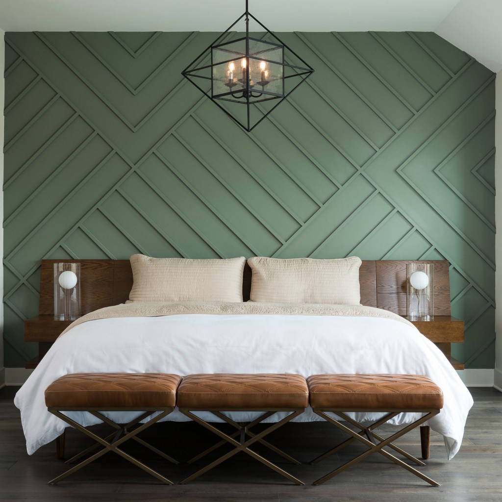 Bedroom with green wood panel accent wall