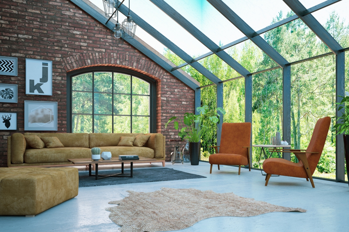 exposed red brick wall in living room with large windows