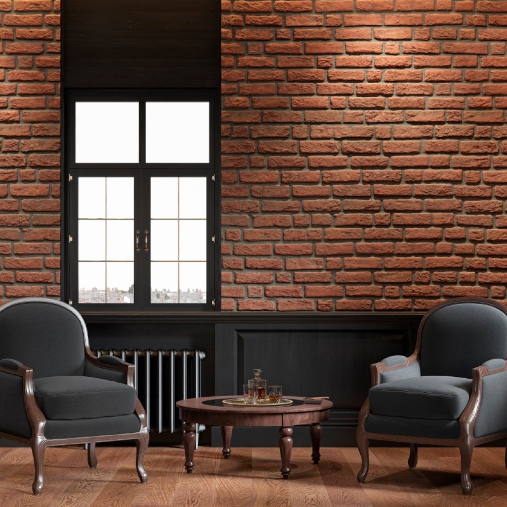 exposed red brick wall with dark color paneling and chairs