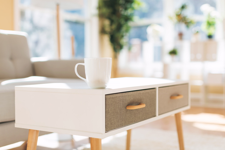 Table with coffee cup on it