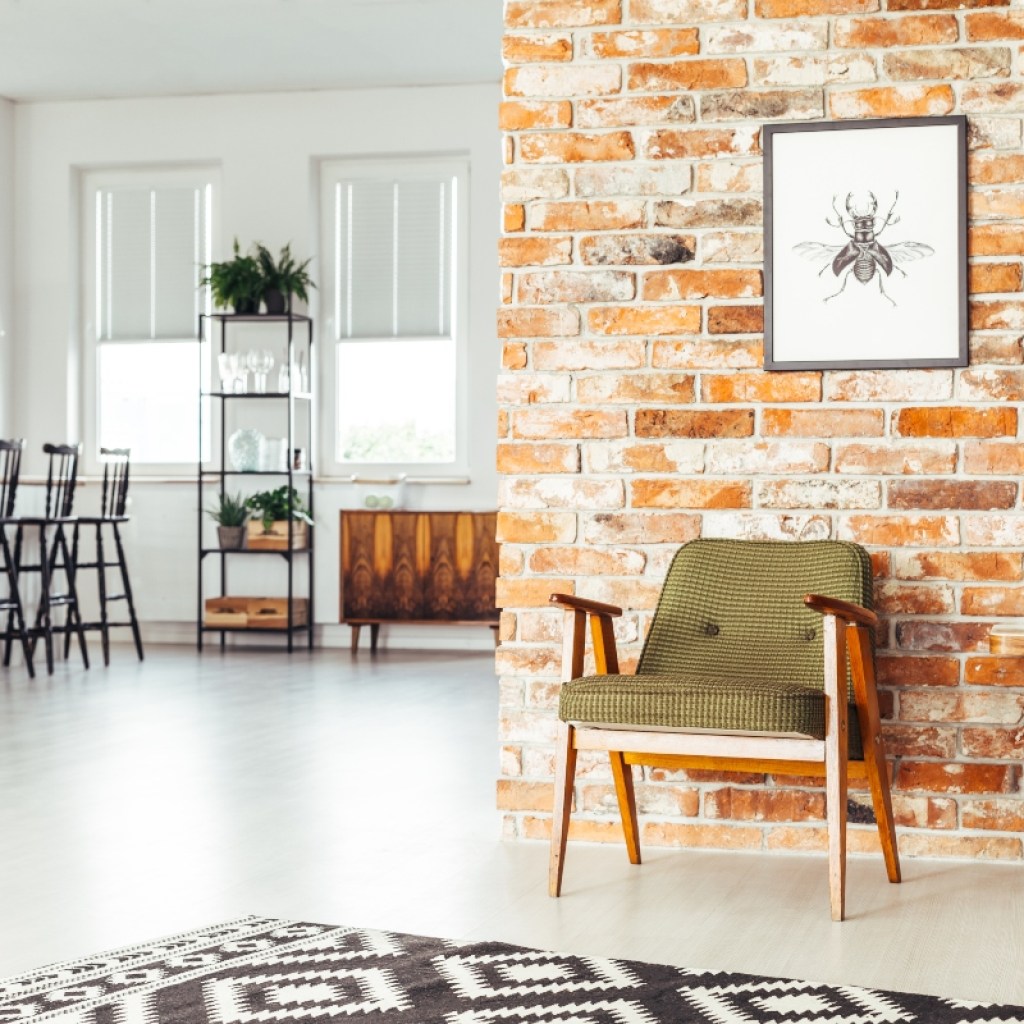 light modern room with exposed red brick wall
