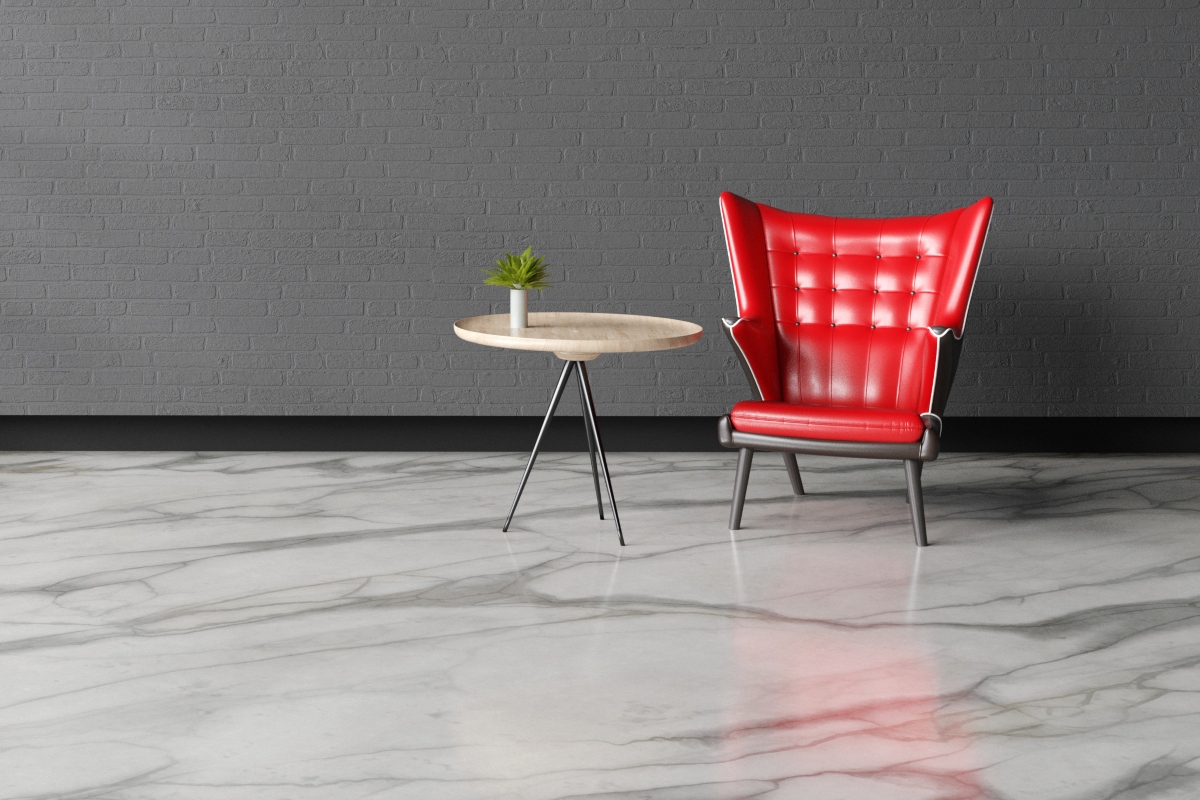 marble flooring in grey room with red chair and side table