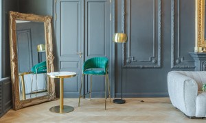 Modern regencycore aesthetic with blue walls and ornate mirror