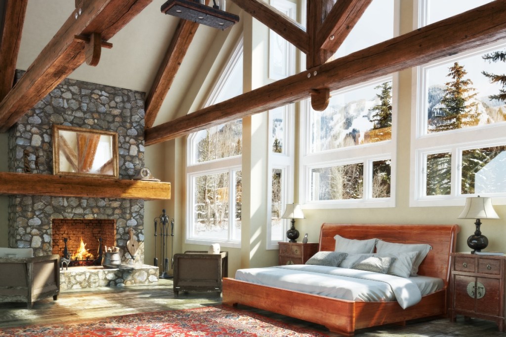 Rustic Scandinavian design bedroom with fireplace