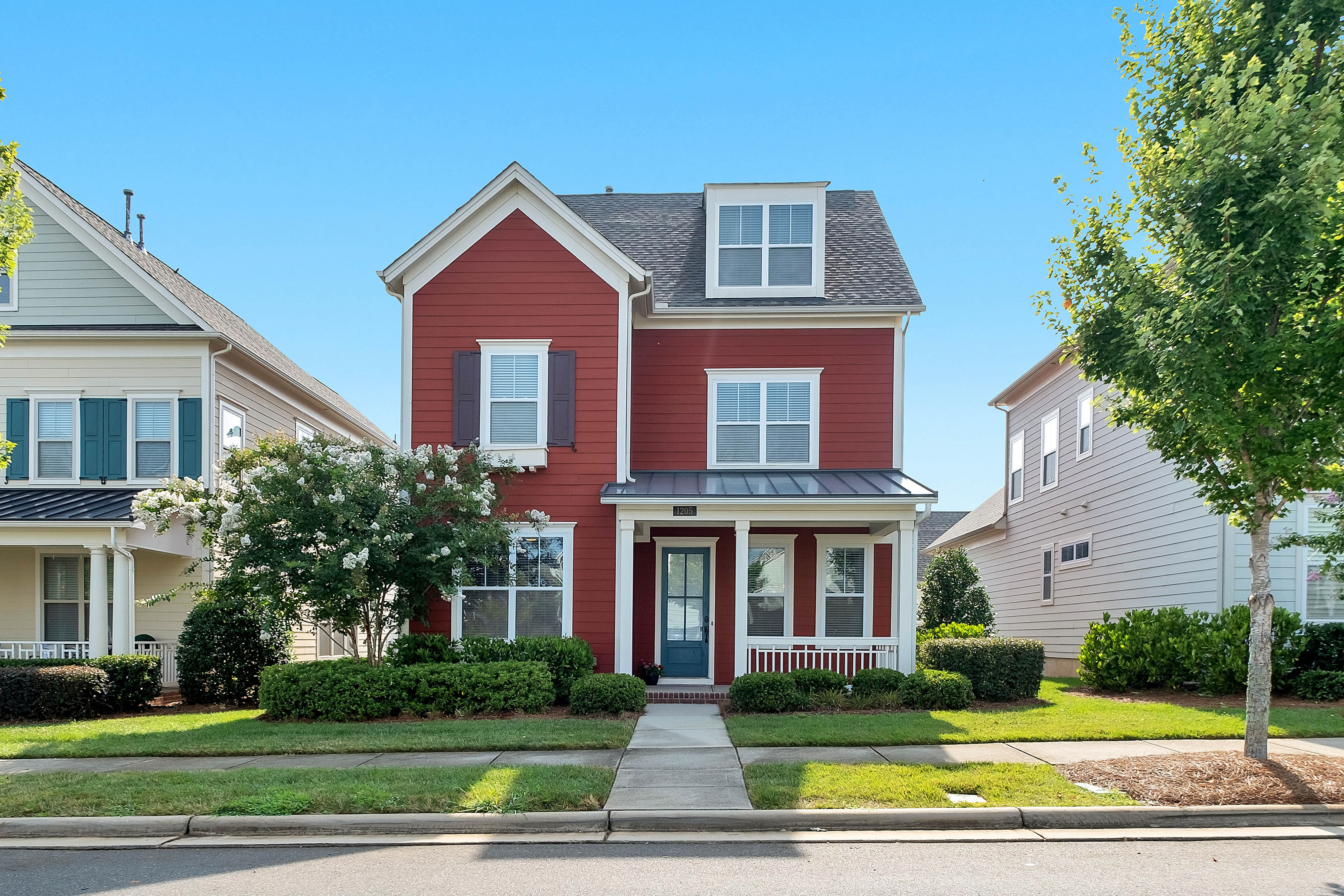 Small red house with blue and white accents