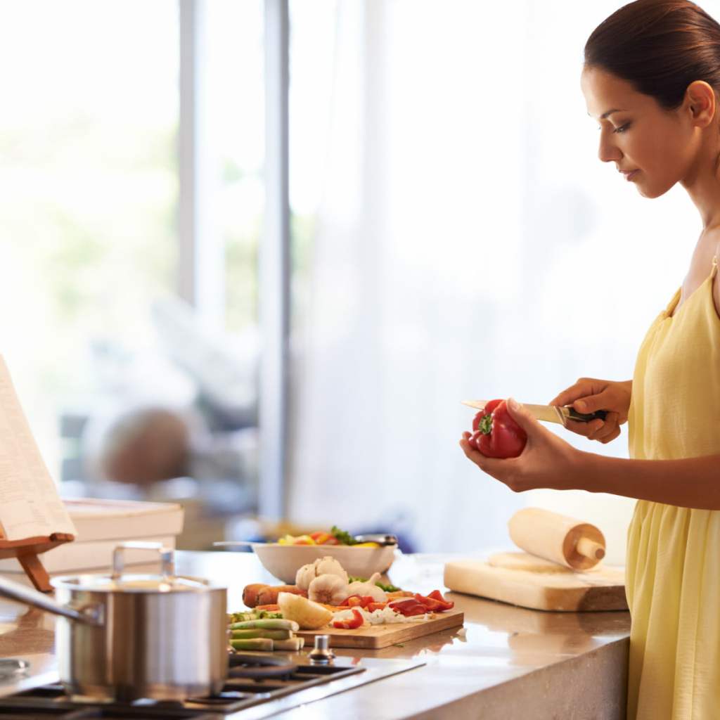 Woman cooking in kitchen.